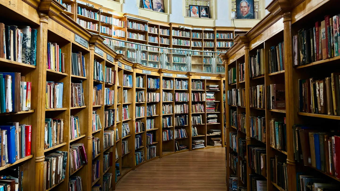 a long row of bookshelves filled with lots of books