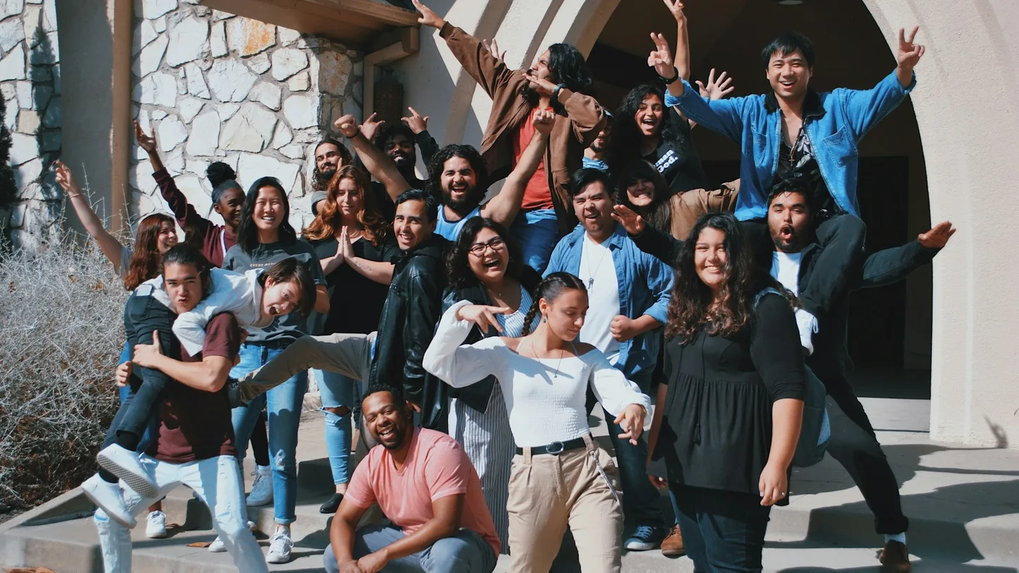 standing and sitting of people taking group photo
