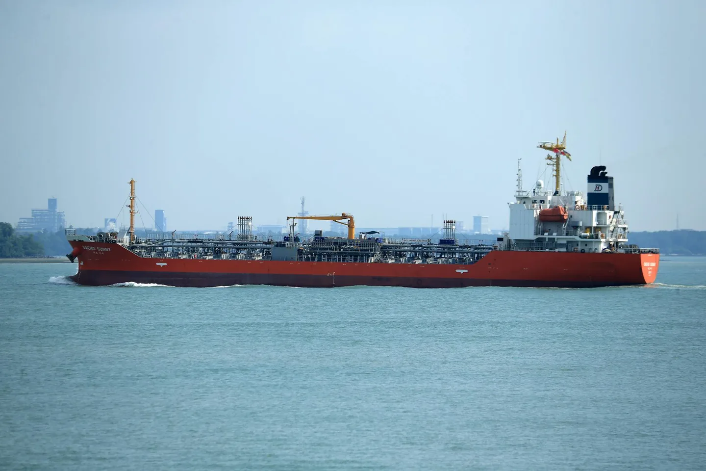 Oil tanker in commercial harbor representing Strait of Hormuz shipping